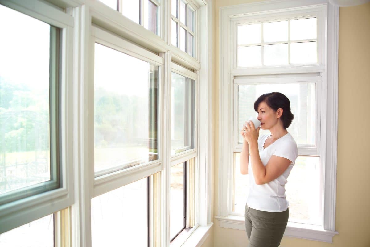 Woman Looking Out the west facing Window