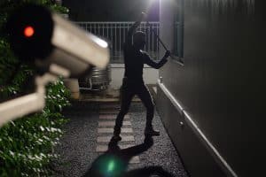 man trying to break in window